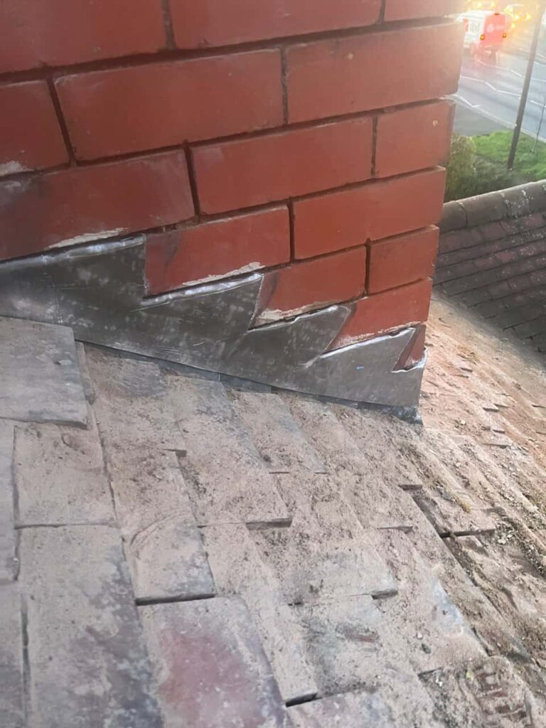 This is a photo of new leadwork being installed around an old chimney. Works carried out by TRP Roofing Selby